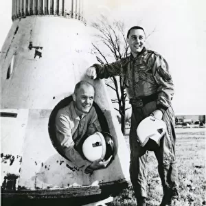 John Glenn and Virgil Grissom pose beside Mercury spacecraft