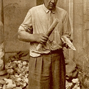 M. Leon Coutier finishing a hand-axe of Acheulean type