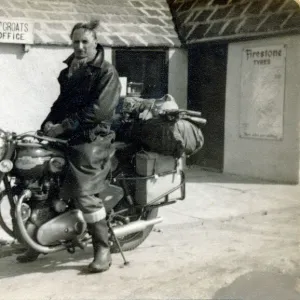 Man on his 1956 / 7 Royal Enfield motorcycle