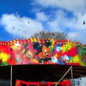 Mickey Mouse characters on a fairground roundabout