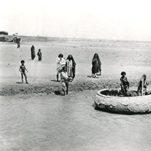 Natives with boat on the Tigris near Baghdad, Iraq