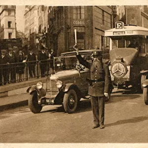 Parisian Officer directing traffic on Les Grand Boulevards