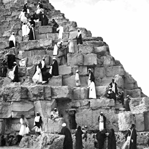 People climbing the Great Pyramid, Egypt