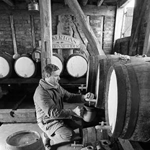 Pouring cider in cider barn at Dunkertons cider, England