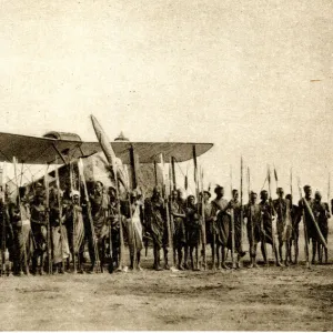 Shulluks pose by Cobhams aeroplane, Malakal, Sudan