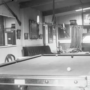 Snooker room with two players