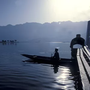 Tobacco smoking boatman silhouette, Dal Lake, Kashmir