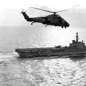 A Westland Wessex flies over HMS Albion (R07)