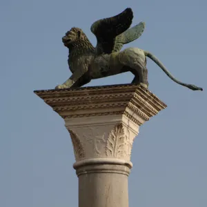 Winged lion statue of Saint Mark on a granite column in the