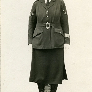 Woman police officer posing in uniform, London