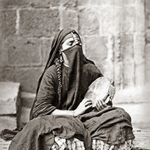 Woman with tambourine, Cairo, Egypt, circa 1880s