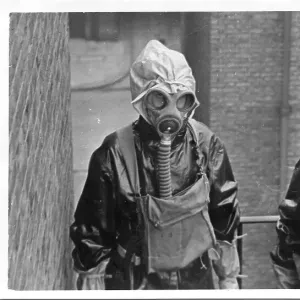 Two women police officers in gas masks, London, WW2