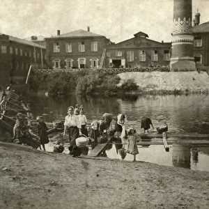 Women Washing Clothes in a River