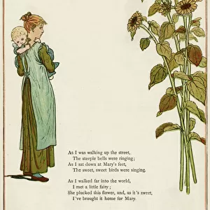 Young woman holding a baby, with sunflowers
