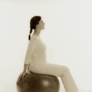 Woman sitting on exercise ball