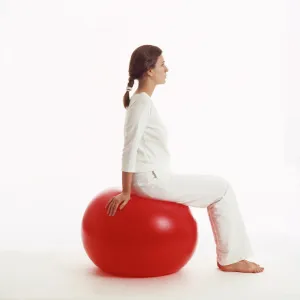 Woman sitting on exercise ball