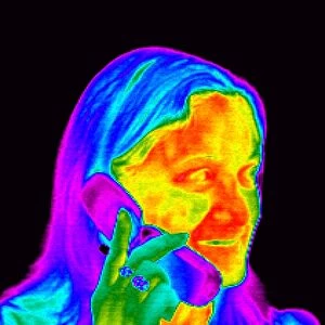 Woman using a mobile phone, thermogram
