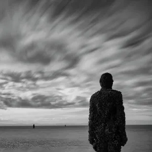 England, Merseyside, Antony Gormley Another Place. Antony Gormley sculptures at Crosby Beach near Liverpool in England