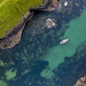 Aerial view of a yacht moored in Port Quin, Cornwall, England, United Kingdom, Europe