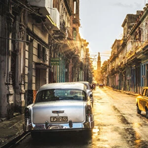 American and Russian vintage cars at sunset, La Habana (Havana), Cuba, West Indies