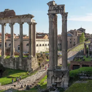 Ancient Roman Road traverses the columns and ruins in the Forum of Ancient Rome