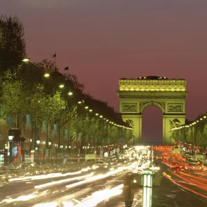 Avenue des Champs Elysees and the Arc de Triomphe at night, Paris, France, Europe