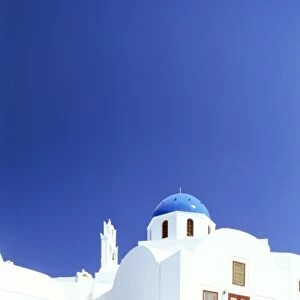 Blue domed church and whitewashed buildings