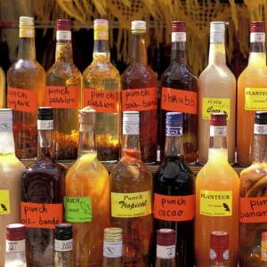 Bottles of local rum drinks at Le Diamant village