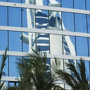 Burj Al Arab Hotel reflected in the Jumeirah Beach Hotel