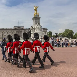 Changing the Guard at Buckingham Palace, New Guard marching, colourful spectacle