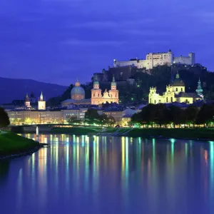 City and castle at night from the river, Salzburg, Austria, Europe