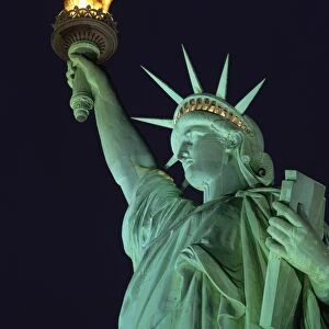 Close-up of the Statue of Liberty illuminated at night, in New York, United States of America