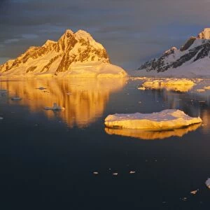 Coastal landscape lit by the midnight sun, Antarctic Peninsula, Antarctica