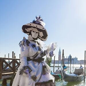 Colourful mask and costume of the Carnival of Venice, famous festival worldwide, Venice