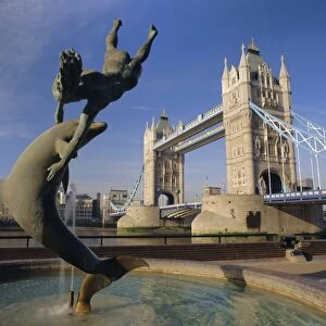 Dolphin sculpture and Tower Bridge, London, England, UK