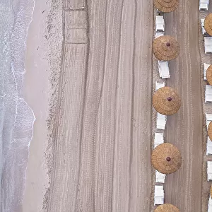 Drone view of beach straw umbrellas on an empty beach, Sicily, Mediterranean Sea, Italy, Europe