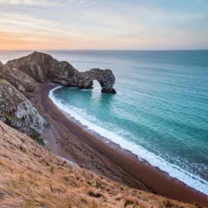 Durdle Door at sunrise, Lulworth Cove, Jurassic Coast, UNESCO World Heritage Site