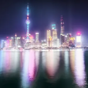 Foggy yet colorful skyline of Shanghai Pudong at night, Shanghai, China, Asia