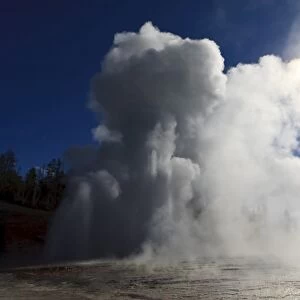 Grand Geyser erupts and steam blocks the sun, Upper Geyser Basin, Yellowstone National Park, UNESCO World Heritage Site, Wyoming, United States of America, North America