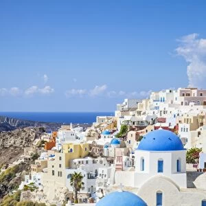 Greek church with three blue domes in the village of Oia, Santorini (Thira), Cyclades Islands, Greek Islands, Greece, Europe