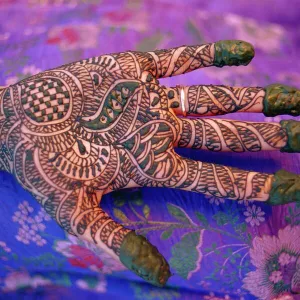 Hand decorated with design in henna