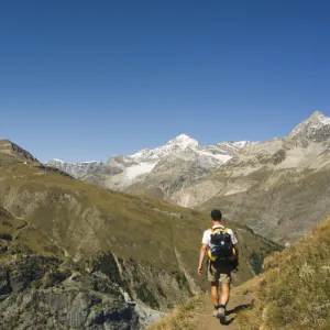 Hiker walking on trail near the Matterhorn