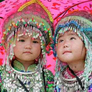 Hmong children under umbrella in the monsoon (rainy) season, Sapa, Vietnam, Indochina