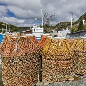 Lobster traps near fishing boat outside St. Johns, Newfoundland, Canada, North America
