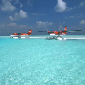 Maldivian air taxi seaplanes parked on sandbank, Maldives, Indian Ocean, Asia