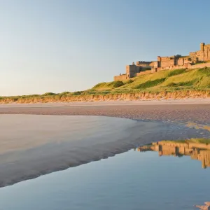 Morning light on the beach at Bamburgh Castle, Northumberland, England