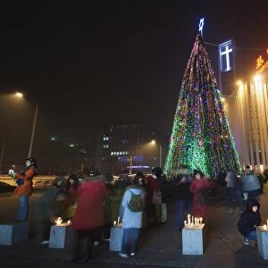 Night time illuminations of a Christmas tree and decorations at a Christian church celebrating in Beijing