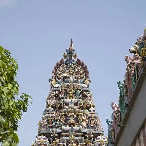Ornate gopuram with colourful Hindu deities on Sri