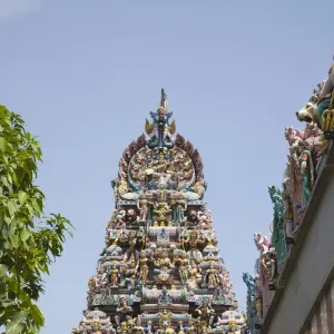 Ornate gopuram with colourful Hindu deities on Sri