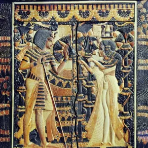 Painted ivory plaque from the lid of a coffer showing Tutankhamun and Ankhesenamun in a garden